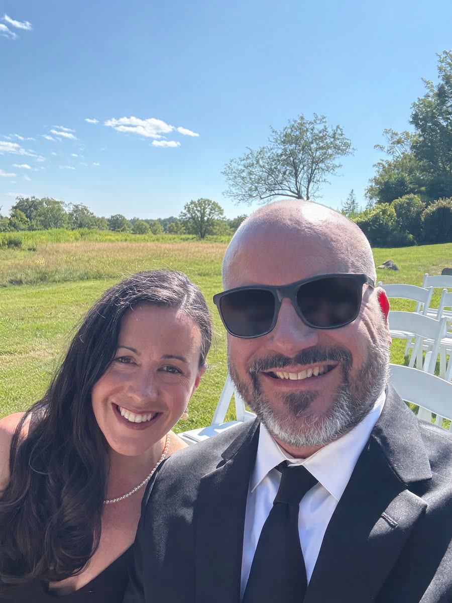 Ken and his wife on a sunny summer day